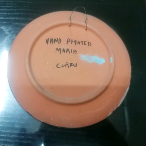 Handmade decorative clay plate painted by hand
