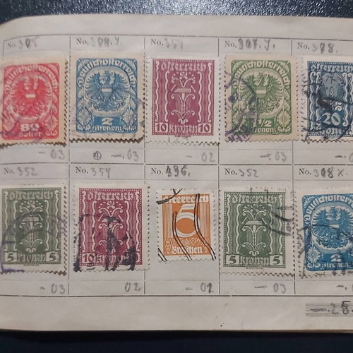 Stamp album used with Austrian stamps, all sealed with hinges