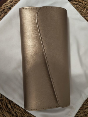 Women's clutch like new, gold with long chain strap