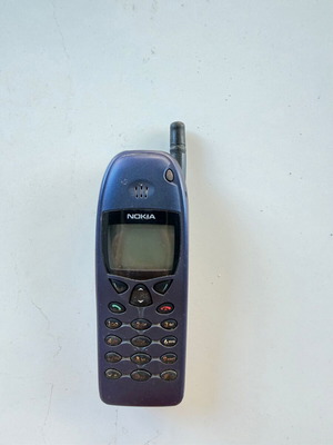 Nokia 6110 and 6103 vintage mobile phones used with chargers