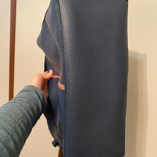 Blue shoulder bag used with brown details