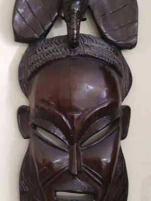 Large wooden decorative African mask used handmade