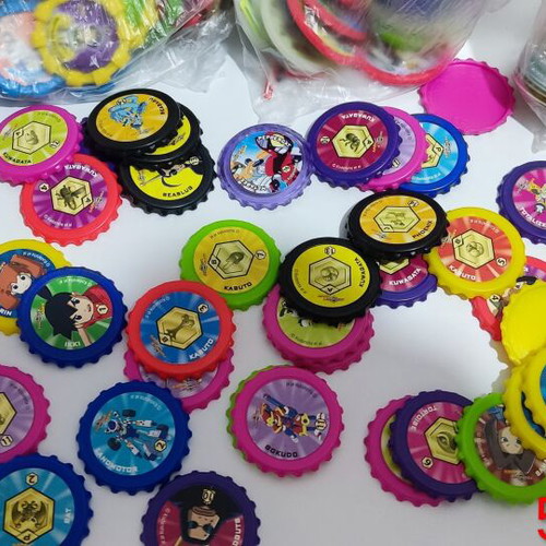 Various Pokémon and other collectible pogs