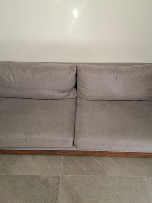 Three-seater sofa used, gray fabric with metal legs and wooden base