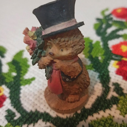 Hedgehog miniature figurine used, decorative with hat and flowers