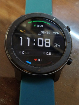 Amazfit GTR smartwatch with detachable 22mm strap and charging cable