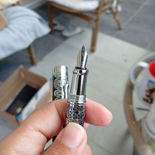 Pens in like-new condition with various designs
