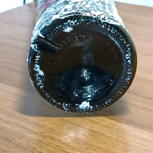Painted wine bottle used for design