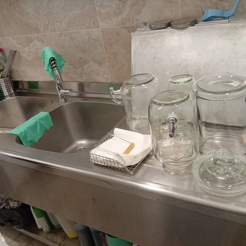 Professional stainless steel counter with 2 sinks used