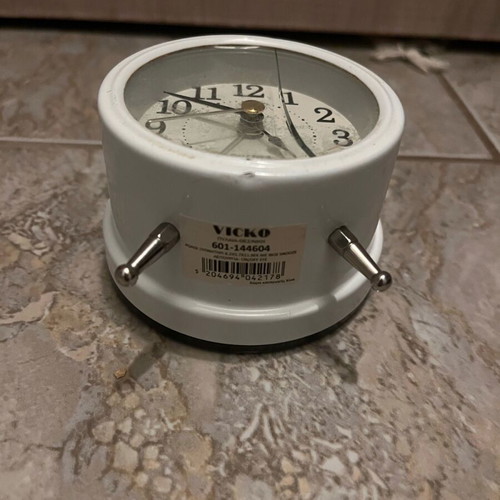 Table clock used, white with crack