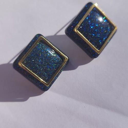 Handmade geometric earrings with blue glitter resin