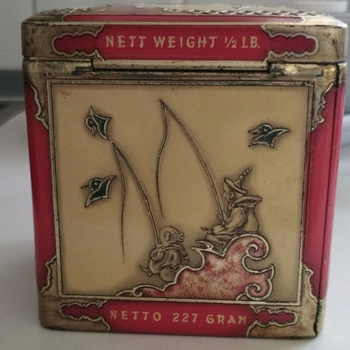 Niemeyer vintage tea tin used, embossed scenes, tin material