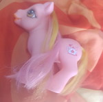 Large pink pony toy with colorful mane and tail