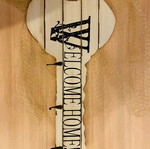 Key-shaped entry coat rack used with three hooks