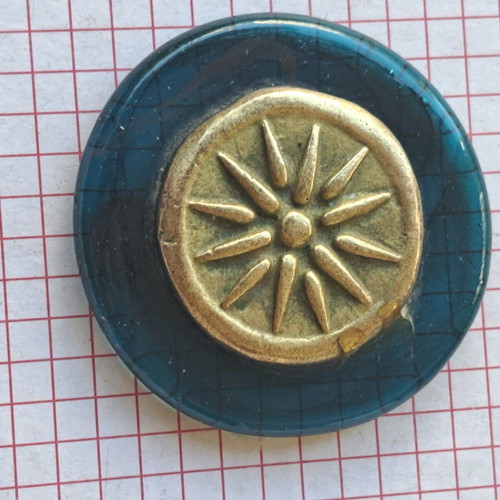 Paperweight with Vergina Star used, brass on glass base