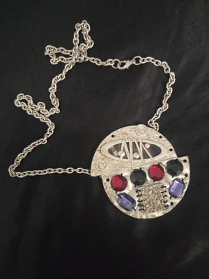 Vintage statement necklace with large embossed silver-tone pendant