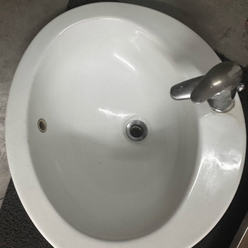 Bathroom sink used with faucet