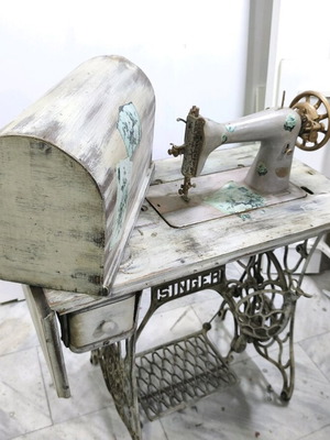 Singer sewing machine decorated with decoupage and aging, used