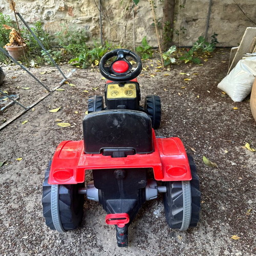 Small red pedal tractor for kids like new