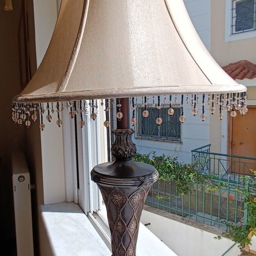 Table lamp with silk shade and carved base