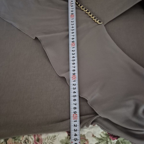 Blouse gray-beige elastic with gold detail and ruffle