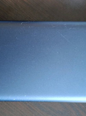 Xiaomi powerbank 10,000mAh used with two USB ports and one old type