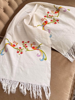 Embroidered table runner with colorful bird design