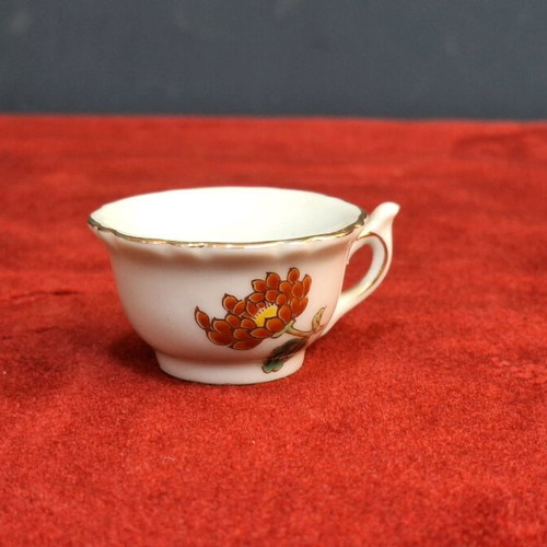 Japanese porcelain cup used with hand-painted chrysanthemum