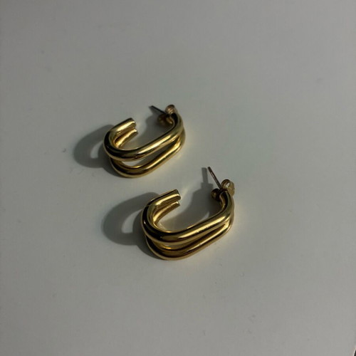 Steel hoop earrings in gold color new in box