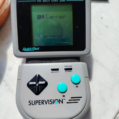 Watara Supervision console used with 3 games