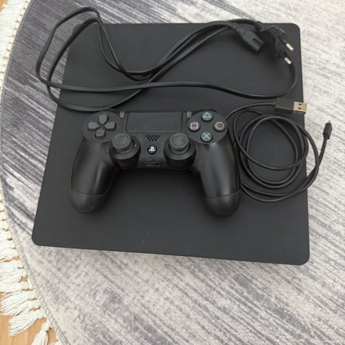 PlayStation 4 Slim 1TB console used with original Sony controller