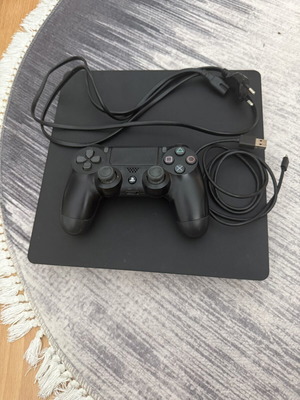 PlayStation 4 Slim 1TB console used with original Sony controller
