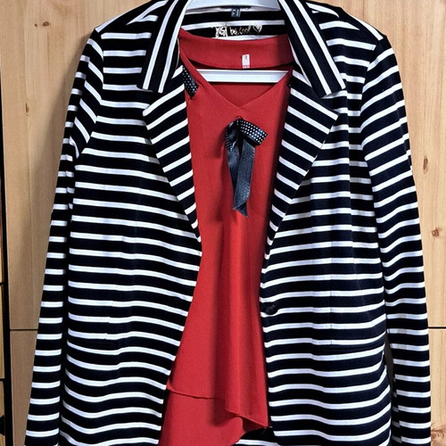 Women's elegant red blouse with black and white ribbon