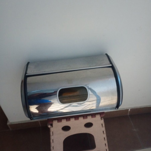 Metal bread box with two dents