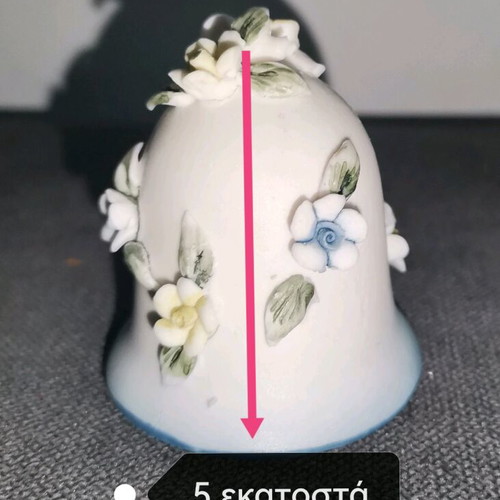 Ceramic bell used with embossed flower designs