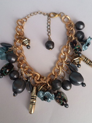 Bracelet with charms used, gold with dark blue details