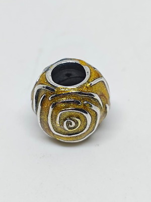Silver charm bead with gold glitter enamel spiral design like new