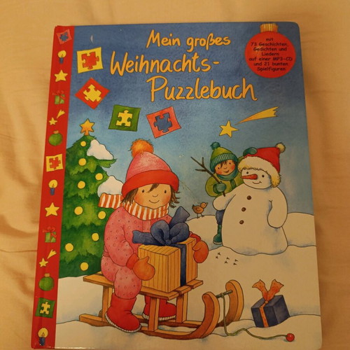 Christmas book with 15-piece puzzle and figures used