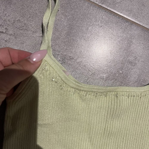 Ribbed green top with thin straps and subtle rhinestones
