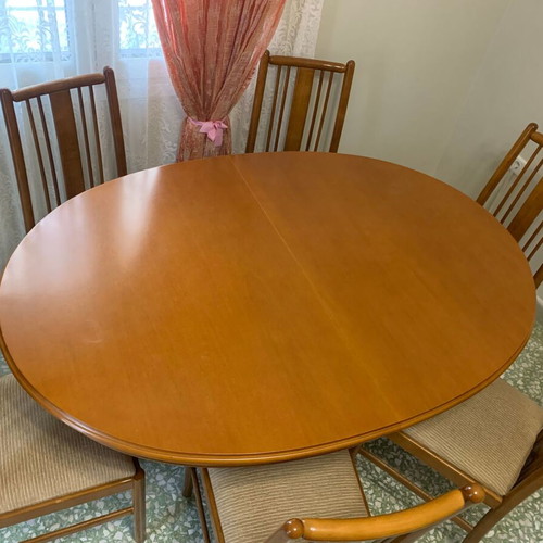 Oval dining table with 6 chairs used, with extensions