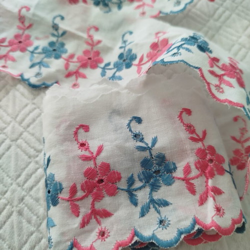 Cotton machine lace with pink and blue flowers