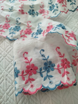 Cotton machine lace with pink and blue flowers