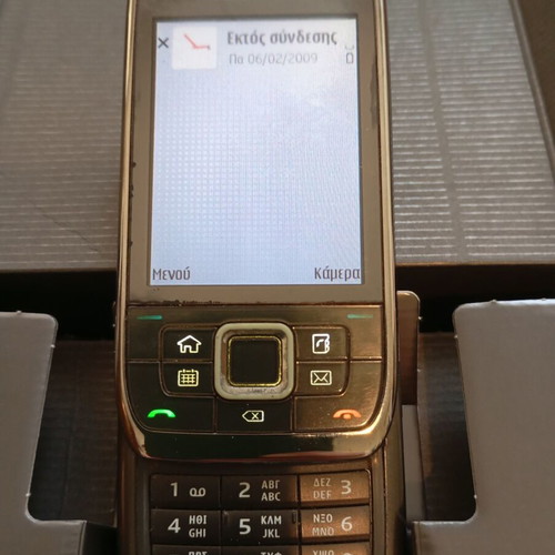 Nokia E66 retro slider phone used with original accessories