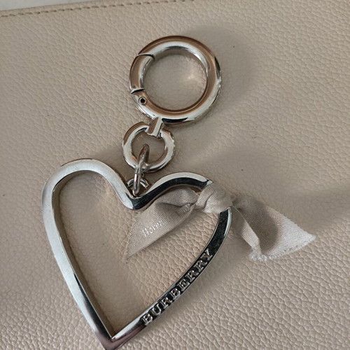 Burberry silver heart bag charm like new
