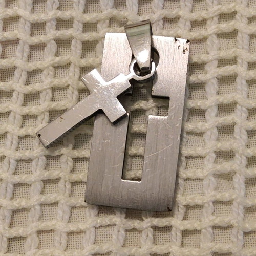 Pendant with steel cross like new, silver color