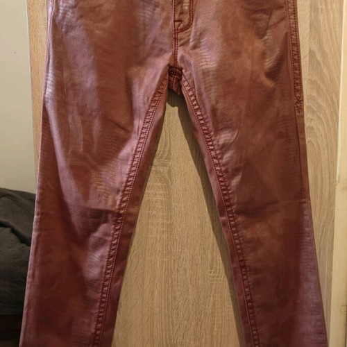 Rock Revival women's low rise red snake embossed denim jeans used