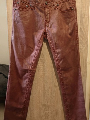 Rock Revival women's low rise red snake embossed denim jeans used