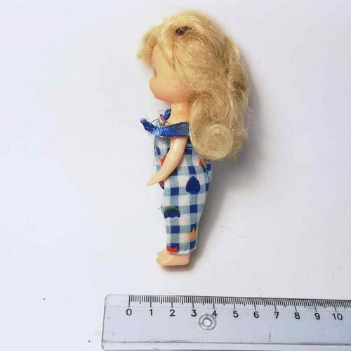 Plastic doll used with torn clothes
