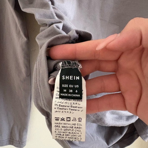 Grey top with side ruching used, size M