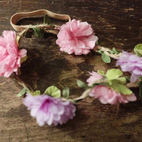 Hairband wreath used with 5 pink purple flowers and green leaves